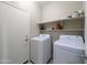 Laundry room with washer, dryer and shelving at 21209 N 40Th Ave, Glendale, AZ 85308