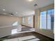 Sunlit living room featuring carpet and ceiling fan at 21209 N 40Th Ave, Glendale, AZ 85308