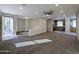 Open living room with kitchen and access to backyard at 21209 N 40Th Ave, Glendale, AZ 85308