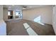 Spacious living room with carpet, ceiling fan and kitchen view at 21209 N 40Th Ave, Glendale, AZ 85308