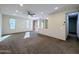 Spacious living room with neutral carpet and recessed lighting at 21209 N 40Th Ave, Glendale, AZ 85308
