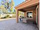 Relaxing patio with table and chairs, adjacent to house at 21209 N 40Th Ave, Glendale, AZ 85308