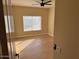 Bright bedroom with hardwood floors and large window at 22110 N Lobo Ln, Sun City West, AZ 85375