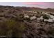 Desert homes nestled within a rugged mountain neighborhood with scenic views of surrounding arid landscape and distant mountains at 2249 E Taxidea Way, Phoenix, AZ 85048