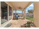 Covered back patio with tile flooring, a ceiling fan, and serene backyard views at 2249 E Taxidea Way, Phoenix, AZ 85048
