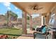 Resort-style backyard with covered patio and a sparkling swimming pool at 2249 E Taxidea Way, Phoenix, AZ 85048