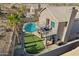 Aerial of backyard with a pool, artificial turf, a balcony and mountain views at 2249 E Taxidea Way, Phoenix, AZ 85048