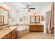 Bright bathroom with dual vanities, a large soaking tub, and lots of natural light at 2249 E Taxidea Way, Phoenix, AZ 85048