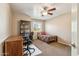 Bedroom area offering a desk, a bookcase, and a comfortable bed at 2249 E Taxidea Way, Phoenix, AZ 85048