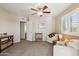 Spacious bedroom featuring plush carpet, neutral walls, and a ceiling fan at 2249 E Taxidea Way, Phoenix, AZ 85048