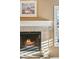 Close-up of a cozy fireplace with mantel and shuttered windows at 2249 E Taxidea Way, Phoenix, AZ 85048