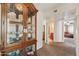 Hallway view featuring a display cabinet and access to other rooms at 2249 E Taxidea Way, Phoenix, AZ 85048