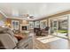 Well-lit living room with hardwood floors, a fireplace, and a patio slider at 2249 E Taxidea Way, Phoenix, AZ 85048