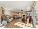 Cozy living room with hardwood floors, a fireplace, and comfortable seating at 2249 E Taxidea Way, Phoenix, AZ 85048