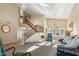 Spacious living room with lots of light, a staircase, and stylish furnishings at 2249 E Taxidea Way, Phoenix, AZ 85048