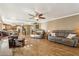 Open concept living area featuring hardwood floors and neutral decor at 2249 E Taxidea Way, Phoenix, AZ 85048