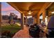 Covered patio with ceiling fan, outdoor seating, and a barbecue grill at 2249 E Taxidea Way, Phoenix, AZ 85048