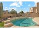 Inviting backyard pool with desert landscape and serene mountain views, perfect for relaxation and outdoor enjoyment at 2249 E Taxidea Way, Phoenix, AZ 85048