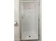 Modern all-white tiled shower with glass door and chrome fixtures at 2249 E Taxidea Way, Phoenix, AZ 85048
