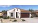 Single-story home with brown garage door and desert landscaping at 23445 W Fulton St, Buckeye, AZ 85326