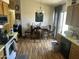 Kitchen and dining area featuring tile flooring, wooden cabinets and stainless steel dishwasher at 235 S Stardust Ln, Apache Junction, AZ 85120