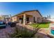 Spacious backyard with patio, grill, and artificial turf at 26407 N 166Th Ave, Surprise, AZ 85387