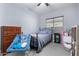bedroom with dresser, bed, and shelving at 26407 N 166Th Ave, Surprise, AZ 85387