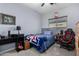 Bedroom with a bed, desk, and gaming chair at 26407 N 166Th Ave, Surprise, AZ 85387