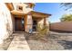 Front entry with walkway, welcome mat and small garden at 26407 N 166Th Ave, Surprise, AZ 85387
