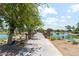 Scenic walkway over a pond with lush landscaping at 2833 N Hawthorn Dr, Florence, AZ 85132