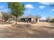 Horse barn with surrounding trees and rock landscaping at 29305 N 146Th St, Scottsdale, AZ 85262