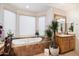 Bathroom featuring a large soaking tub and updated vanity at 29305 N 146Th St, Scottsdale, AZ 85262
