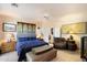 Comfortable bedroom with plush bed, sitting area, and decorative accents at 29305 N 146Th St, Scottsdale, AZ 85262