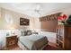 Cozy guest bedroom with a full-size bed and window seat at 29305 N 146Th St, Scottsdale, AZ 85262