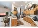 Eat-in kitchen with wood cabinets, breakfast bar, and views to Gathering room at 29305 N 146Th St, Scottsdale, AZ 85262