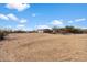 Large pasture with riding arena and barn in background at 29305 N 146Th St, Scottsdale, AZ 85262