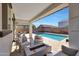 Relaxing backyard with sparkling pool, fire pit, and patio furniture at 3446 N Mayfair St, Mesa, AZ 85213
