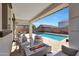 Relaxing backyard with sparkling pool, fire pit, and patio furniture at 3446 N Mayfair St, Mesa, AZ 85213