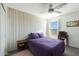 Bright bedroom with purple bedding and colorful wall art at 3446 N Mayfair St, Mesa, AZ 85213