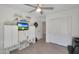 Bedroom with ceiling fan, hardwood floors, walk-in closet, and custom-built storage and shelving at 3446 N Mayfair St, Mesa, AZ 85213