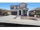 Inviting two-story home with a classic design, a cozy bench, and a convenient two-car garage at 3446 N Mayfair St, Mesa, AZ 85213