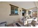 Cozy patio furniture arrangement with fire pit and sliding glass door at 3446 N Mayfair St, Mesa, AZ 85213