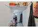 Compact storage area with shelving and rod for hanging items, maximizing space for organization and convenience at 3446 N Mayfair St, Mesa, AZ 85213