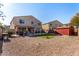 Landscaped backyard with patio, shed, and gravel area at 35834 W Cartegna Ln, Maricopa, AZ 85138