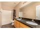 Bathroom with double sinks, granite countertop, and bathtub at 35834 W Cartegna Ln, Maricopa, AZ 85138