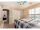 Bedroom with a queen bed and access to another bedroom at 35834 W Cartegna Ln, Maricopa, AZ 85138
