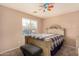 Bedroom with a queen bed and ceiling fan at 35834 W Cartegna Ln, Maricopa, AZ 85138