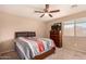 Bedroom with a double bed and dresser at 35834 W Cartegna Ln, Maricopa, AZ 85138