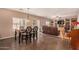 Casual dining area with table and chairs, open to the living room at 35834 W Cartegna Ln, Maricopa, AZ 85138