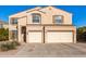 Two-story house with beige exterior, two-car garage, and landscaping at 35834 W Cartegna Ln, Maricopa, AZ 85138
